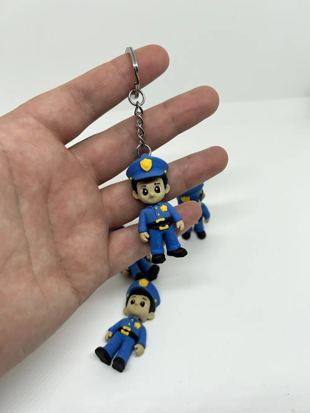 Mini Flexi Police Officer Figurine angle – 3D Printed Articulated Police Toy by FOFUS Kerala