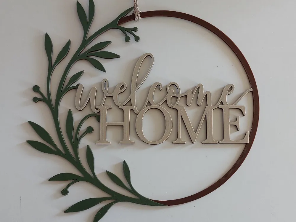 Welcome Home minimalist 3D printed door sign with raised lettering mounted at an entryway